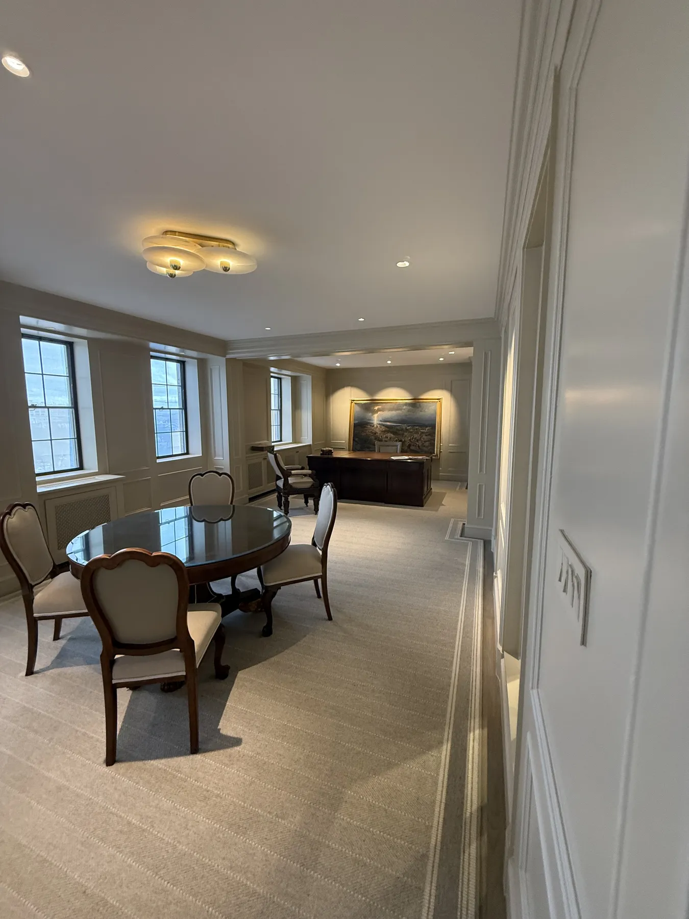 Finished dining room with wall detailing and coordinated openings