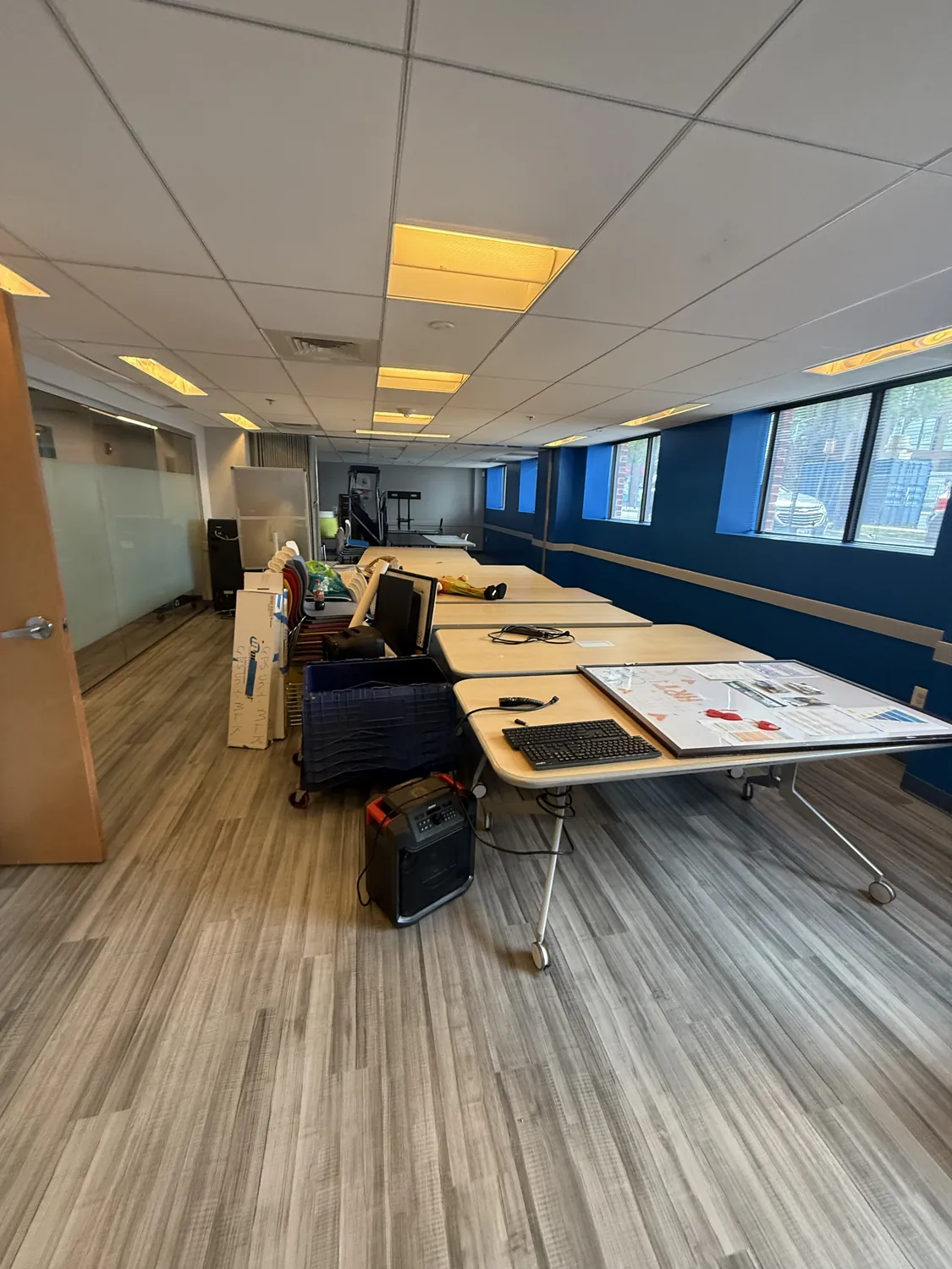 Commercial office ceiling grid coordinated above an active workspace