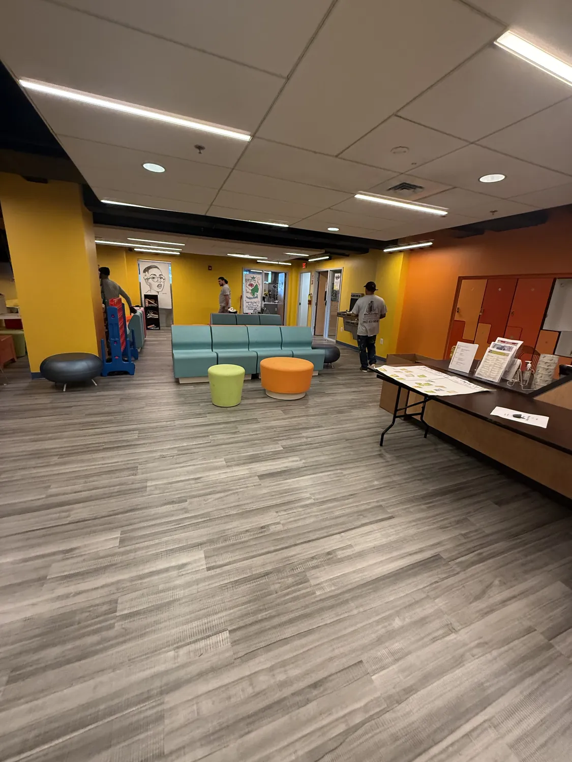 Finished commercial interior with coordinated ceiling devices and lighting