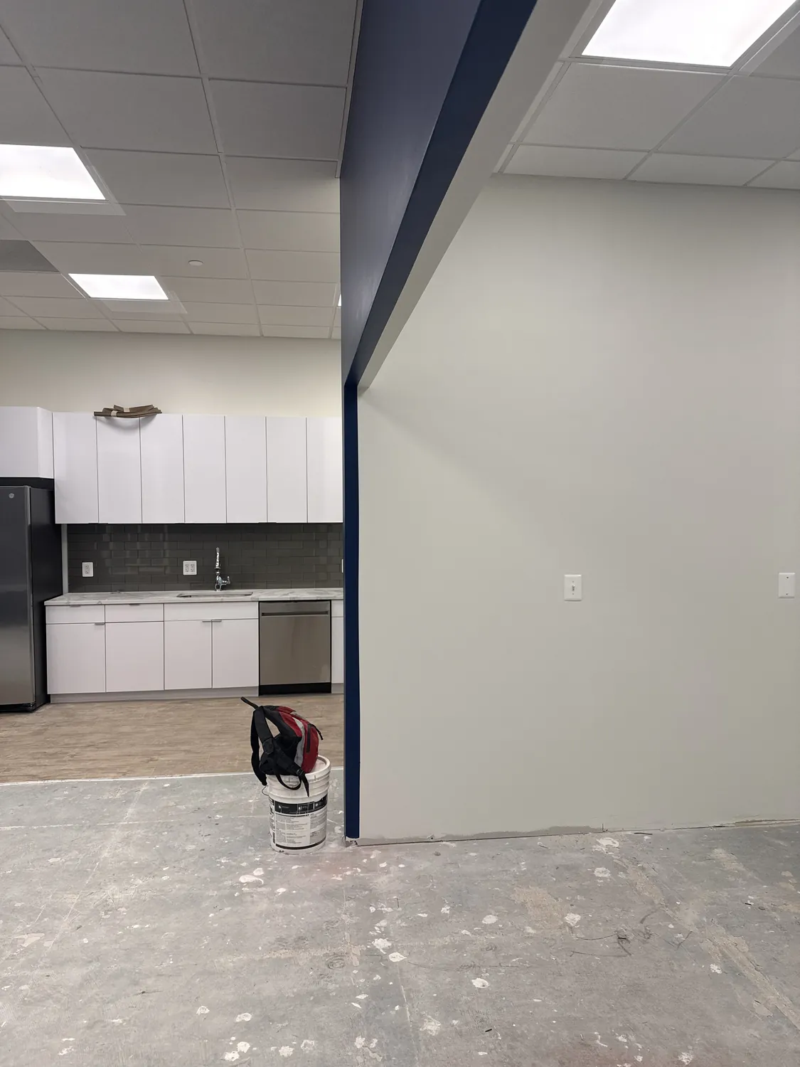 Commercial room with completed wall surfaces prepared for final finishes